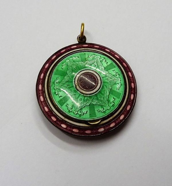 A lady's gilt and enamelled pendant powder compact, gilt within, fitted with a mirror to the lid interior, the exterior with green, violet and white e