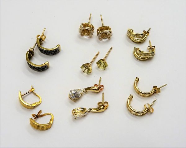 A pair of gold earrings of curved design, detailed 18 K, weight 1 gm and six further pairs of mostly gold and gem set earrings, combined gross weight