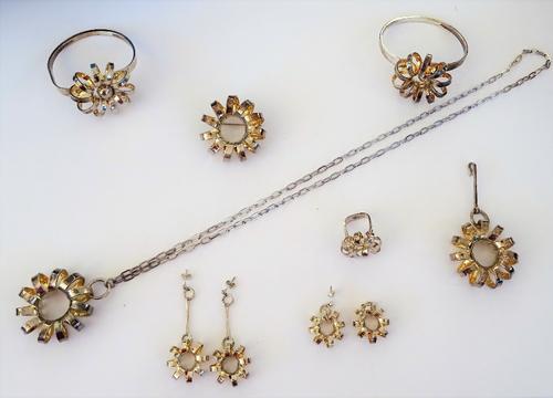 A group of eight items of Norwegian Sterling silver jewellery, each in a spiral design, comprising; two bangles, a brooch, a pendant with a neckchain,