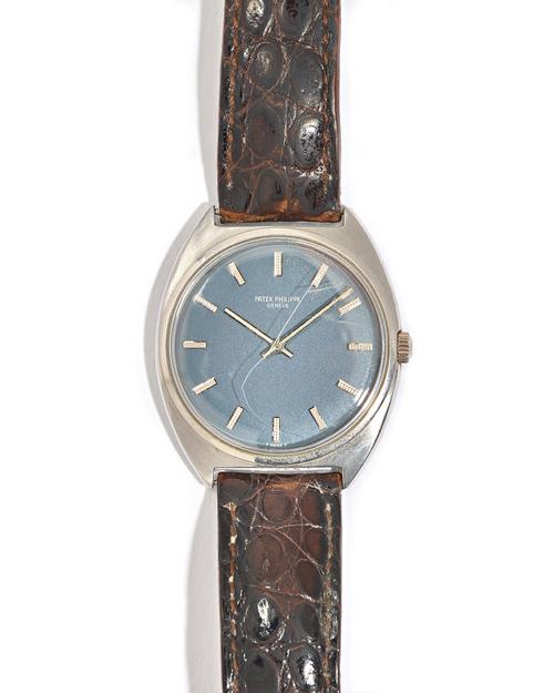 A Patek Philippe steel cased gentleman's wristwatch, the signed dark blue dial with silvered baton numerals and silvered hands, on a  dark brown leath