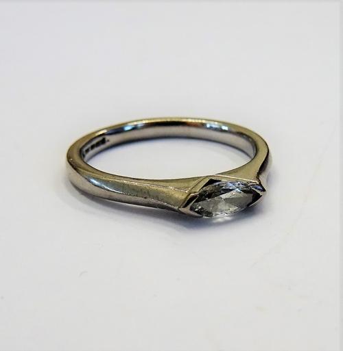 An 18ct white gold and diamond set single stone ring, mounted with a marquise shaped diamond, ring size O, gross weight  3.9 gms, with a case.