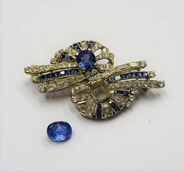 A sapphire and colourless gem set brooch, in a twin spray design, claw set with two oval cut Ceylon sapphires and otherwise set with rectangular cut s