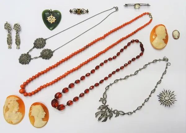 Two silver and marcasite set necklaces, a single row necklace of graduated coral beads, a reconstituted amber bead necklace, a pair of marcasite set e
