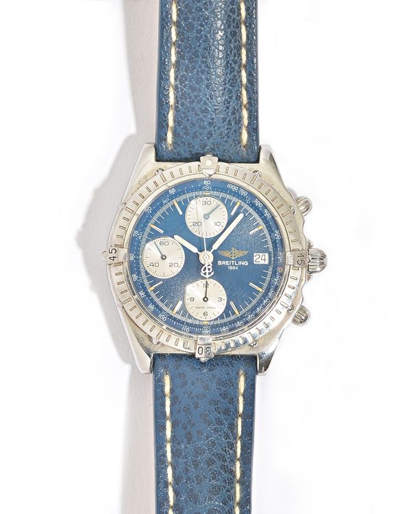 A Breitling steel cased gentleman's chronograph wristwatch, the signed blue dial with three subsidiary dials, date of the month aperture and with cent