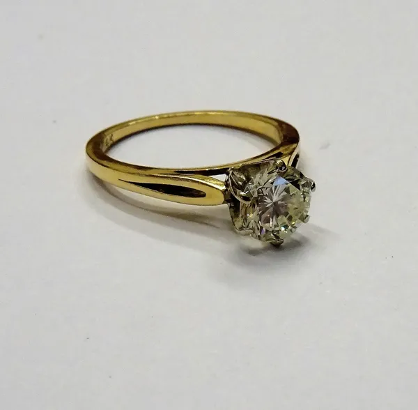 A gold and diamond single stone ring, claw set with a circular cut diamond, detailed 14 K, ring size L, gross weight 2.3 gms.
