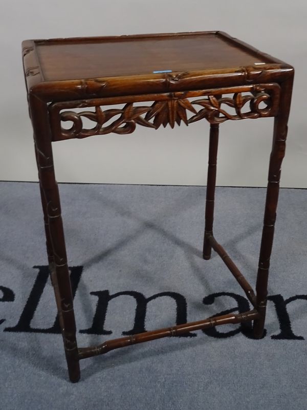 An early 20th century Chinese carved hardwood occasional table, 66cm high.   C1