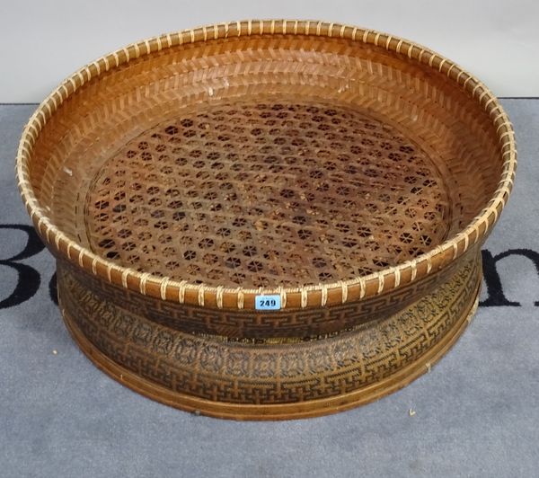 A mid-20th century rattan basket weave low table. D3