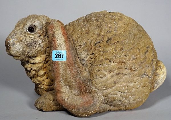 A 20th century painted stone rabbit, 38cm wide x 24cm high.  S4T