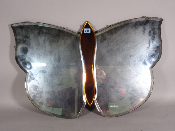 A mid-20th century Art Deco wall mirror with bevelled glass formed as a butterfly, 74cm wide x 48cm high.  D3