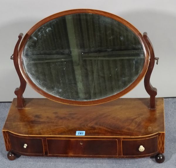 A late Victorian mahogany toilet mirror with three frieze drawers, on bun feet, 58cm wide x 52cm high. D1