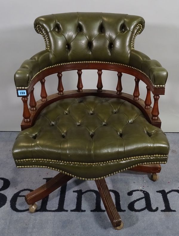 A 20th century hardwood framed office open armchair with button back green leather upholstery, 61cm wide x 82cm high. D1