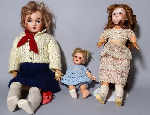 A Simon & Halbig bisque head doll and two further early 20th century bisque head dolls, (3).  S4M