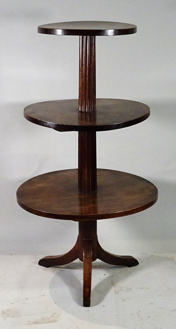 A 19th century Continental mahogany three tier dumb waiter, on tripod base, 62cm diameter x 118cm high.  C1