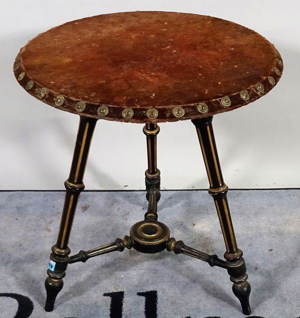 A Victorian parcel gilt ebonised circular occasional table, on three fluted supports, 55cm diameter x 61cm high.  B1