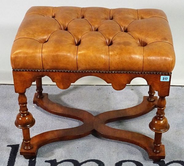 A Queen Anne style walnut footstool with tan buttonback leather upholstery, 59cm wide x 50cm high.  D2