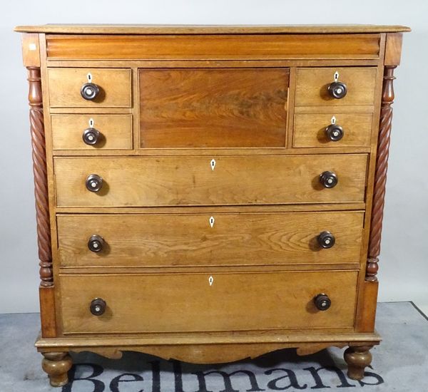 A 19th century Scottish mahogany and oak chest with an arrangement of seven drawers flanked by barley-twist columns, 127cm wide x 132cm high.  A2