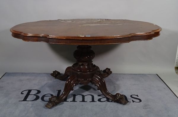 A Victorian figured walnut centre table, the shaped top on turned column and four scroll supports, 153cm wide x 75cm high.   B4