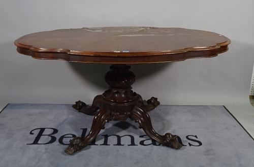 A Victorian figured walnut centre table, the shaped top on turned column and four scroll supports, 153cm wide x 75cm high.   B4