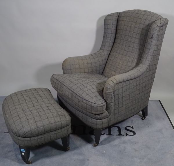 A mid-20th century hardwood framed wingback armchair, grey chequered upholstery on tapering ebonised supports, 72cm wide x 103cm high and a matching f