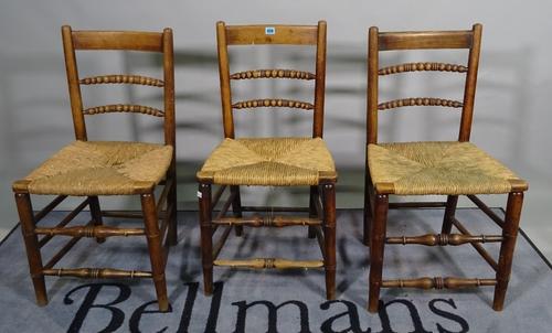 A set of six 19th century ash bar-back dining chairs, bobbin turned backs on turned supports and a pair of Edwardian inlaid mahogany side chairs on ta