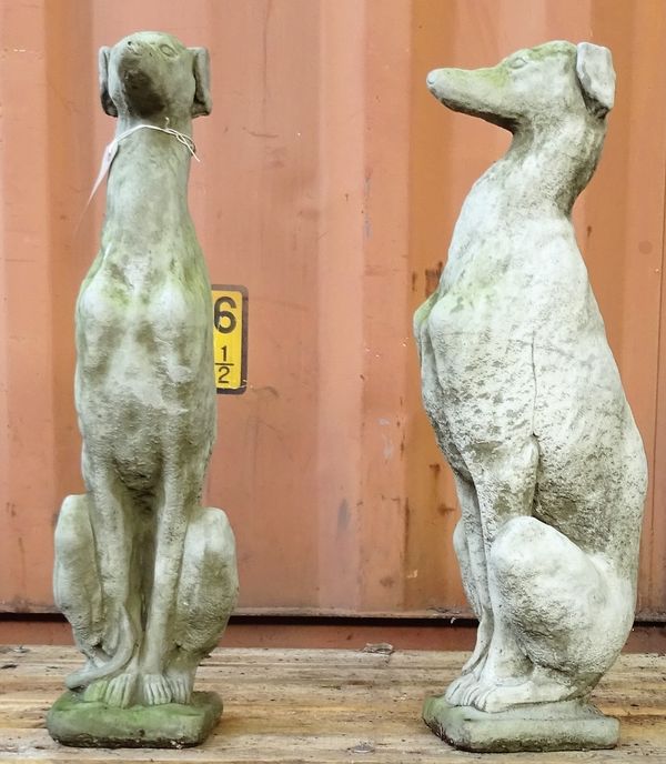 A pair of reconsituted stone figures of greyhounds, 74cm high.  OUT