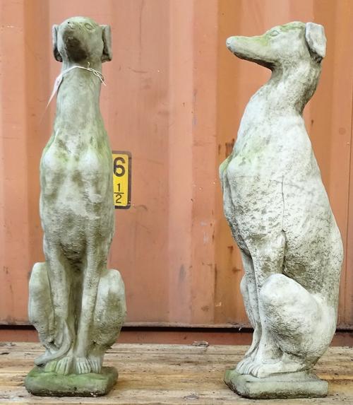 A pair of reconsituted stone figures of greyhounds, 74cm high.  OUT