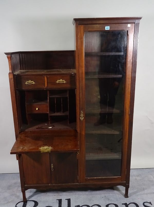 An Arts and Crafts style mahogany side cabinet with three drawers over cupboard base and glazed single door cabinet, 102cm wide x 163cm high.  C5