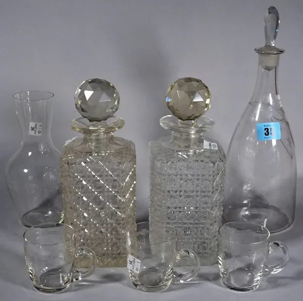 A glass decanter with engraved label, 'White', two square glass spirit decanters, a carafe and three glass cups, (7).   S3T