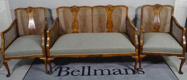 A George II style mahogany framed bergere suite comprising a two seater sofa, 126cm wide x 77cm high and  a pair of low armchairs on cabriole supports