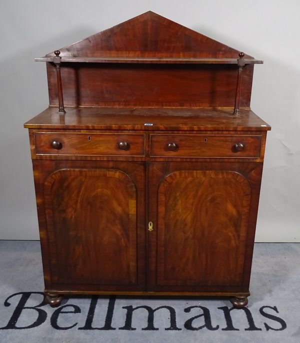 A late Victorian mahogany chiffonier with two drawers over walnut panelled doors on bun feet, 94cm wide x 130cm high.  B4