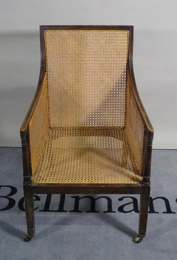 A 19th century mahogany framed bergere armchair, 58cm wide x 96cm high.  C1