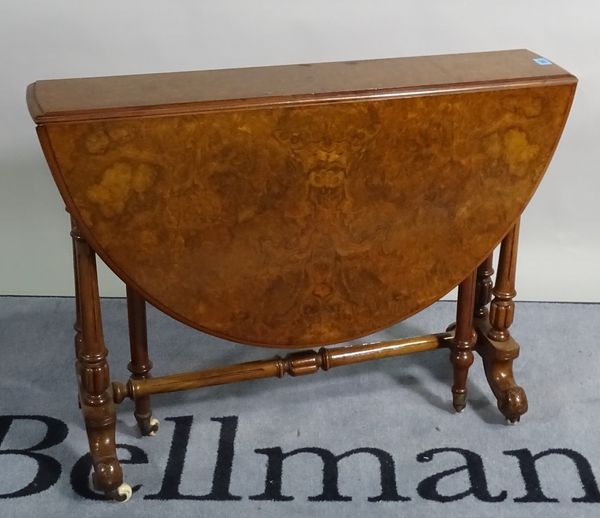 A Victorian walnut Sutherland table on turned supports, 87cm wide x 67cm high. B2