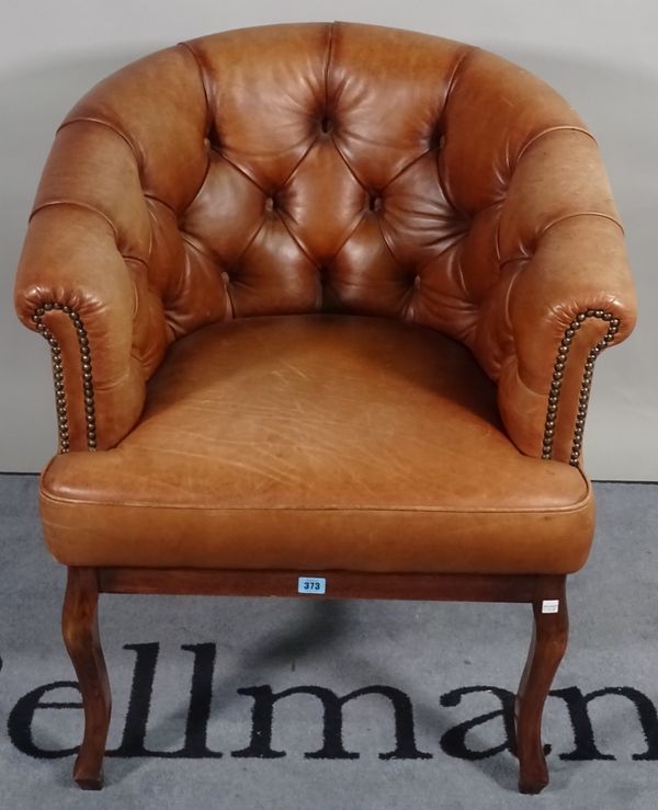 A 19th century French tub chair with brown button back leather upholstery, 68cm wide x 80cm high. D1