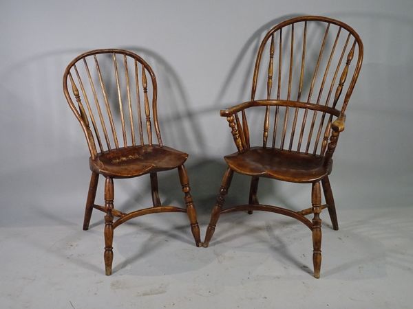 A set of six 19th century ash and elm stick back dining chairs, 57cm wide x 100cm high, to include two carvers and another similar open armchair, (7).