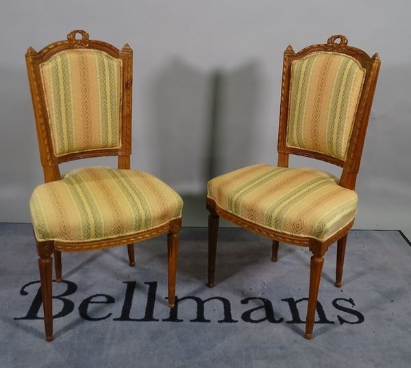 A pair of Louis XVI style stained beech salon chairs with fluted tapering supports, 49cm wide x 102cm high.  B5