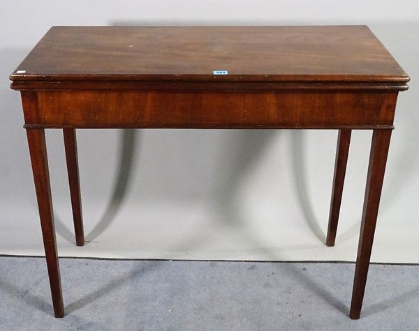 A late George III mahogany foldover card table on tapering square supports, 89cm wide x 73cm high. D2