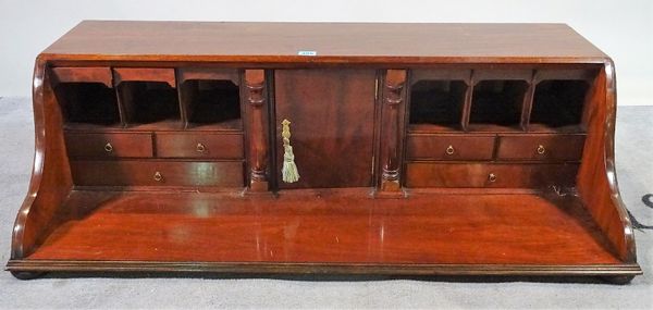 A George III mahogany table top cabinet on bun feet, 104cm wide x 31cm high. D1