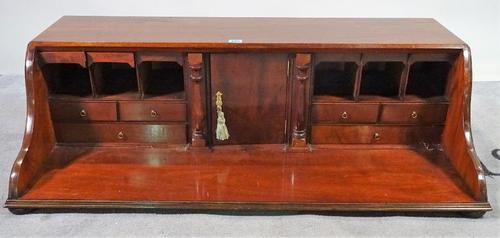 A George III mahogany table top cabinet on bun feet, 104cm wide x 31cm high. D1