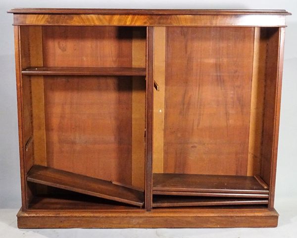 A mahogany floor standing open bookcase, on plinth base. C1