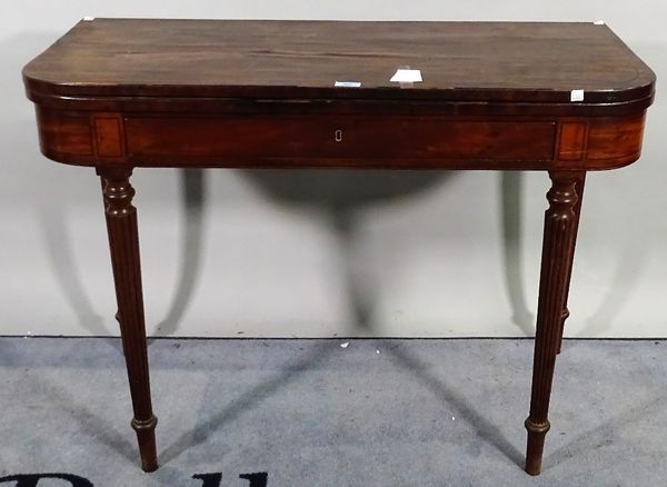 A Regency mahogany and ebony strung fold over tea table on reeded tapering supports.  A2