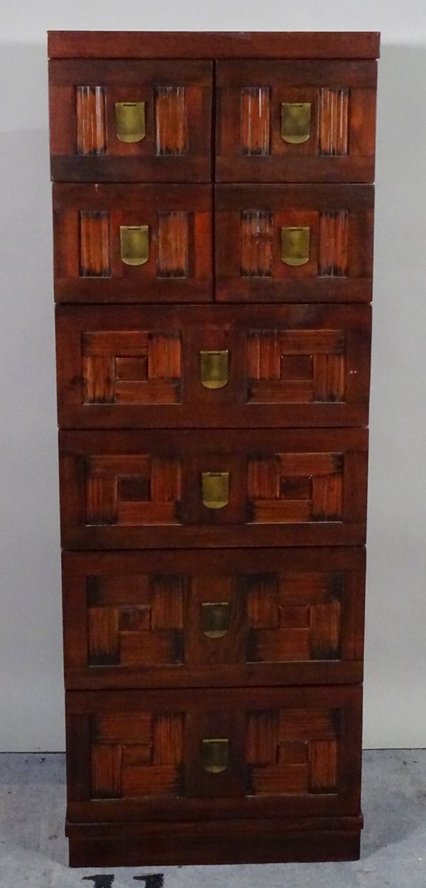 A 20th century hardwood tall chest of four short and four long drawers, 50cm wide x 139cm high and a matching three drawer low chest, 48cm wide x 61cm