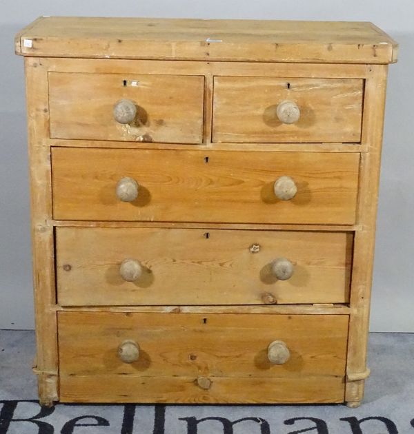 A 20th century pine chest of two short and three long drawers on bun feet, 95cm wide x 103cm high.  B2