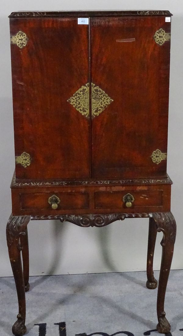 A Victorian style mahogany drinks cabinet over two short drawers on cabriole supports, 60cm wide x 133cm high.   A2