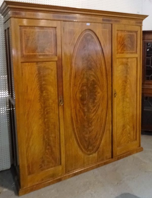 A Victorian mahogany and walnut triple wardrobe, 190cm wide x 200cm high.  A1