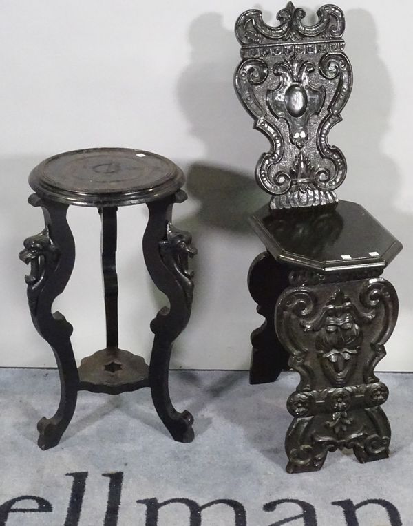 A Victorian oak carved hall chair, 30cm wide x 100cm high and a 18th century style oak jardiniere stand with three downswept supports, 36cm wide x 68c