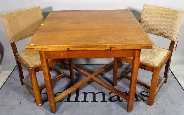 Heals Tottenham Court Road, London WV, a 20th century walnut dining suite comprising; a draw leaf table, 91cm wide x 91cm long x 151cm fully extended,