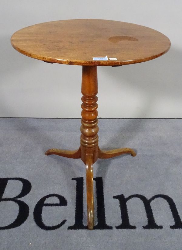 A 19th century mahogany tripod table with turned column and three outswept supports.  D5