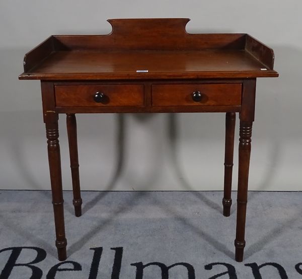 A Victorian mahogany two drawer side table on ring turned support, 86cm wide x 91cm high.   D3