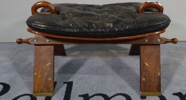 A mid-20th century brass inlaid hardwood camel stool with black leather seat.  D3