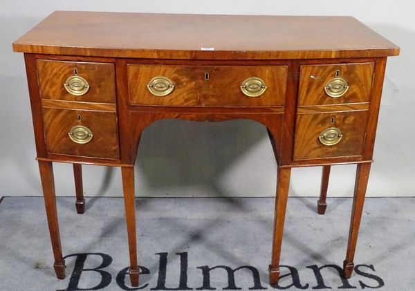 A George III mahogany bowfront sideboard with four short and one long drawer on tapering square supports, 123cm wide x 94cm high. C1